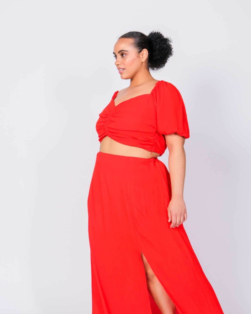 Front of a model wearing a size L (12/14) Rene Angela Crop Top and Skirt Set in Fiery Red by LuvMeMore. | dia_product_style_image_id:266588